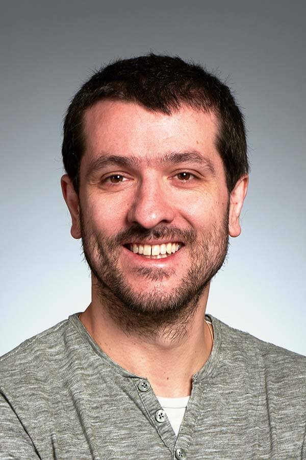 headshot of justino