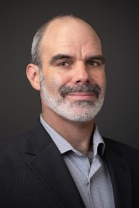 Headshot of Denis Ambio.